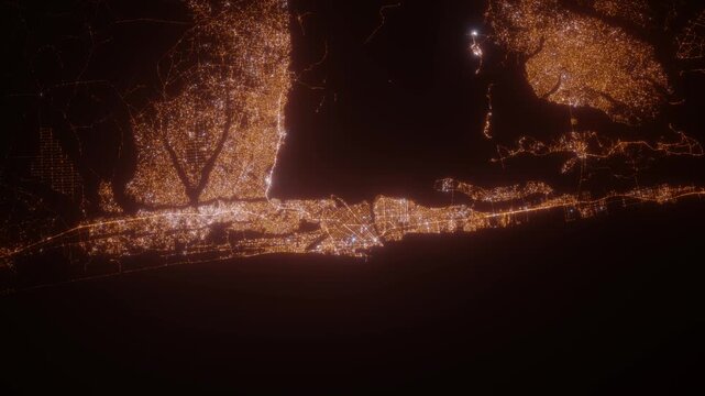 Cotonou (Benin) aerial view at night. Top view on modern city with glow effect. Camera is zooming out, rotating counterclockwise