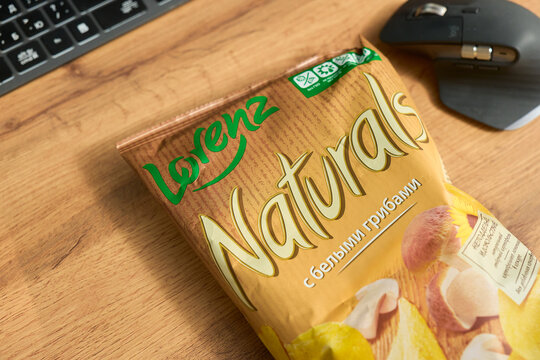 Tyumen, Russia-December 20, 2025: Lorenz Bag of chips on a wooden surface with natural ingredients from a well-known company