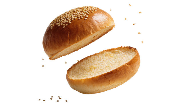 Isolated freshly baked sesame burger bun sliced in half, top piece floating above bottom.