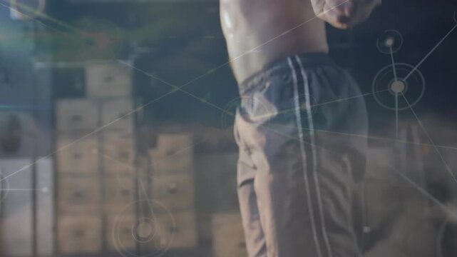 Vertical video: Athlete rotating handles, skipping for fitness while network nodes overlay torso
