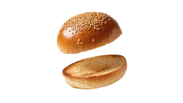 Isolated perfectly toasted sesame seed hamburger bun cut in half with floating pieces