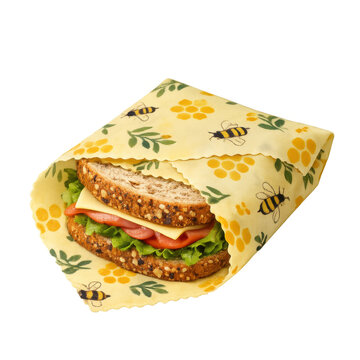 Beeswax food wrap with bee and honeycomb pattern folded around a fresh sandwich with lettuce, tomato, and cheese, sustainable kitchen product, eco-friendly storage, isolated on transparent background