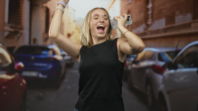 Woman holding smartphone to ear on a street with parked cars and old building facades; contentment travel.