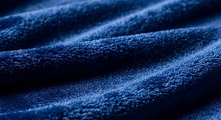 Fototapeta premium A close-up view of a blue fabric with a soft, velvety texture