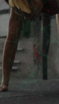 Vertical video: Woman training starting low pushup tucking knee stepping into jumping on rubber mat