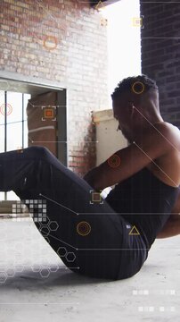 Twisting V-sit athlete in black tank in loft with medicine ball amid HUD overlays for core
