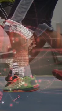 Dribbling basketball, group of players in shorts and shoes moving on blue court, with globe overlay