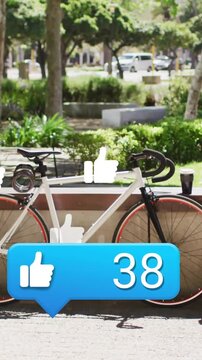 Vertical video: Thumbs flowing over white bike in park driving blue counter to 95 for marketing