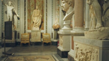 Blurred scene with soft shallow bokeh, defocused statues and marble columns museum  background backplate copyspace calm. © Krakenimages.com