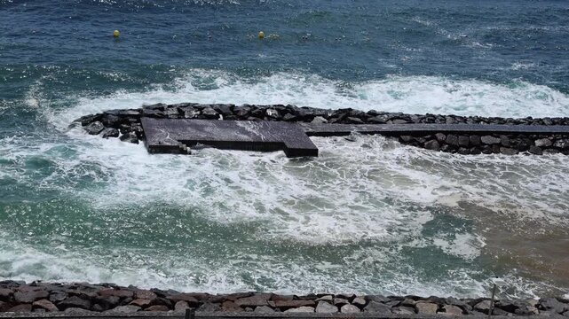 Storm Therese impacting coastal area and shoreline infrastructure in Tenerife