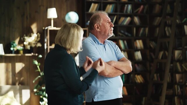 Middle-aged woman fighting with her stubborn senior father, misunderstanding