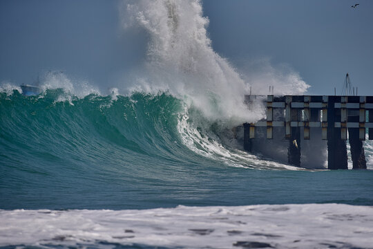 Powerful Pacific swell barrels along the iconic pier of Cabo Blanco, a legendary surf destination where pristine waves, rich fishing heritage, and authentic coastal culture come together, 