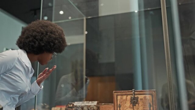 female African American looking at exhibition