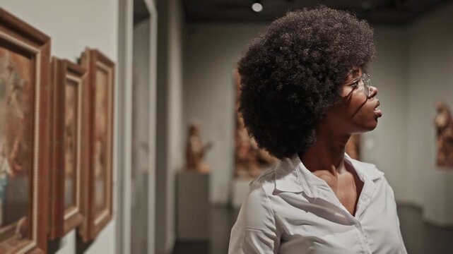 female African American looking at exhibition