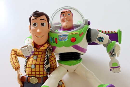 Salvador, Brazil - March 20, 2026: Woody and Buzz Lightyear toys from Toy Story movie franchise on a white background. Toy Story concept.