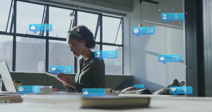 Typing woman dark-green blouse with laptop picking phone, replying to rising notifications in loft