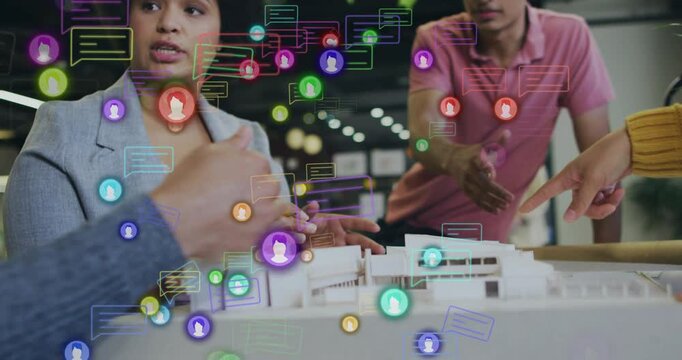 Woman speaking with pencil initiating model review, team pointing, icons floating, refining design