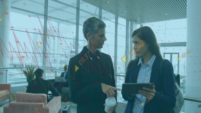 Tablet alert appearing, man holding coffee pointing at tablet while woman tapping, reviewing deck