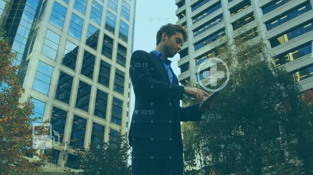 Businessman tapping tablet in plaza, summoning animated icons around him and timestamp readouts