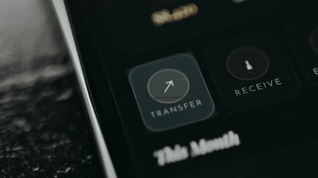 Person taps the Transfer button to send money to another account