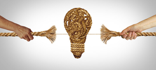 Creative Vision Battle as two opposing ideas in a tug of war pulling a rope on the verge of breaking with a lightbulb or light bulb symbol as a business metaphor for idea conflict.