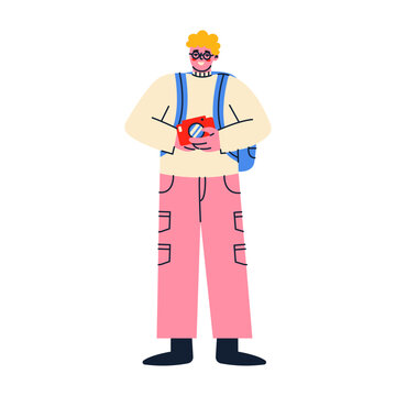 An young man holds a camera. Tourism concept.