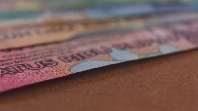 A detailed macro exploration of Indonesian Rupiah banknotes (2022 series), featuring national heroes, vivid colors, and intricate security patterns across denominations from 1,000 to 100,000 Rupiah.