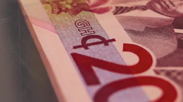 Detailed close-up of the 200 Ghana Cedi note. Highlights the "Big Six" portraits, Jubilee House, and shifting "Gye Nyame" security symbol. Shows the premium blue-grey design of the GHS 200 bill.