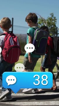 Vertical video: School kids stepping crosswalk, purple bike, blue chat counter growing near group