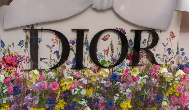 Dior floral display with wildflowers and butterfly backdrop