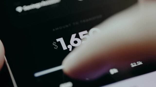 Person is using a slider to specify a certain amount of USD to transfer