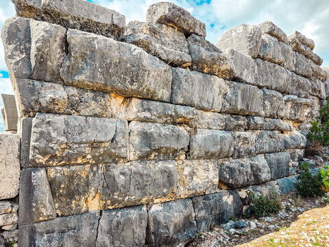 Close-up of massive megalithic stone wall in ancient Illyrian city of Daorson, Bosnia and Herzegovina. Detailed texture of historic ruins, archaeological background and ancient construction.