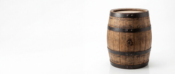Naklejka premium Rustic wooden barrel with metal bands, isolated on a clean white background