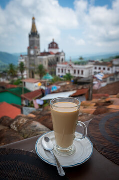 A cup of morning coffee in the magic town of Cuetzalan, Puebla, Mexico, portrait orientation