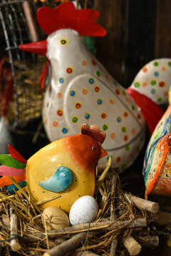
Easter holiday. Colorful metal rooster and chicken at a decor store.