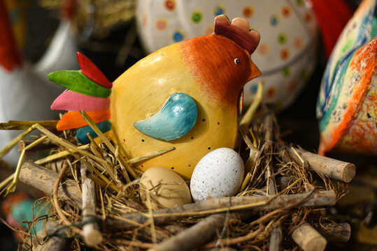 
Easter holiday. Colorful metal rooster and chicken at a decor store.