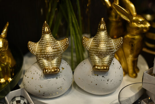 
Easter holiday. Cute Easter chickens sit on eggs in a basket at a decor store.