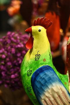 Easter holiday. A colorful metal rooster at a decor store.