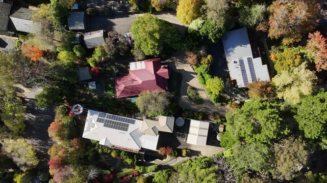 Stirling, South Australia: 4K aerial drone footage featuring leafy roundabouts, autumn-coloured trees, surrounding streets, houses, rural traffic, and scenic Adelaide Hills landscape