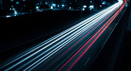 Obraz premium A high-angle view from a balcony at night shows blurred headlights of moving vehicles on a dark urban street during a sleepless late night, dark, commute, sleeplessness