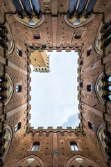 Obraz premium Urban Snapshot Secured. View Of Siena Tower Displayed. An Impressive Urban Scene Featuring Strikingly Designed Siena Tower Captured In Photograph