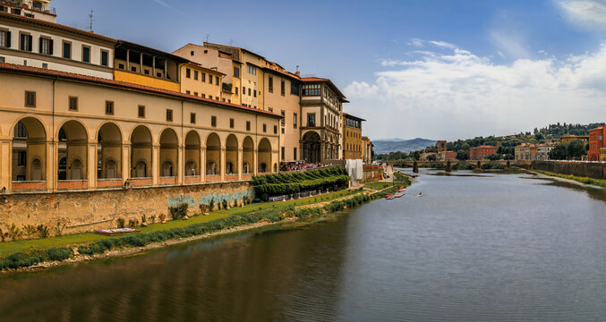 The Vasari Corridor and Uffizi Gallery overlook the Arno River in Florence Italy