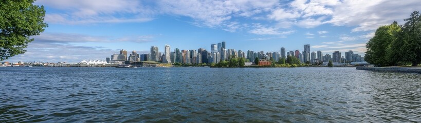Fototapeta premium Panoramic view of Vancouver city Skyline over Vancouver Harbour - Vancouver, British Columbia, Canada