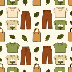 Naklejka premium Seamless pattern of t-shirts, pants, tote bags, and cotton leaves, representing sustainable fashion and eco-friendly clothing.