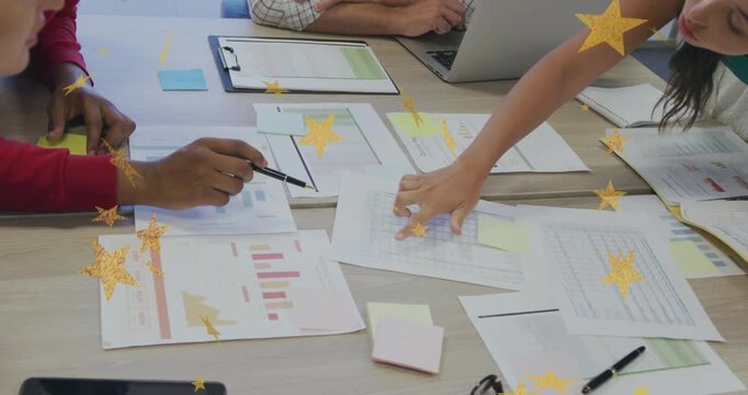 Team pointing and tracing spreadsheet, pen tapping initiating business data review, yellow overlay