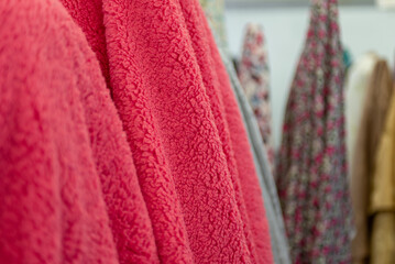 A close up view of a vibrant pink sherpa fleece fabric. © sandor
