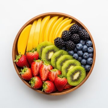 A vibrant fruit bowl featuring bananas, blackberries, blueberries, kiwis, and strawberries
