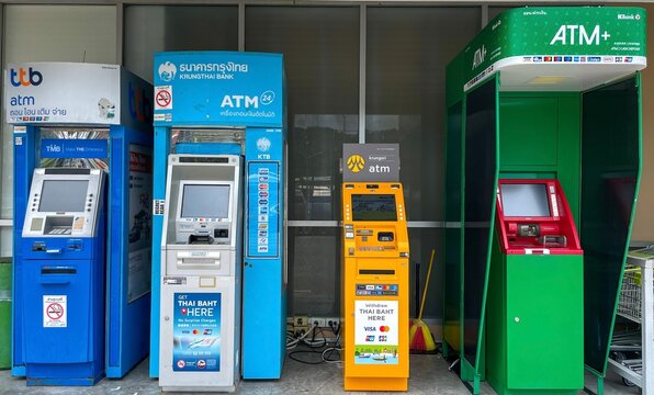 Thailand, Phuket &ndash; September 13, 2025: Four ATMs from different banks are located near a supermarket. Cash withdrawals and financial transactions abroad.