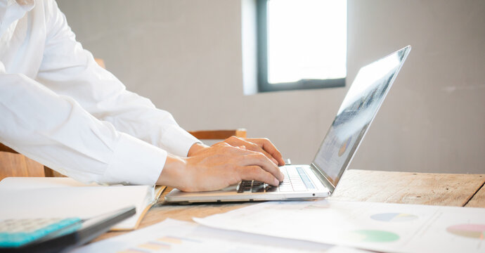 Real estate agents and clients are smiling and discussing property sales contracts, mortgages, investments, signing documents, purchase planning, ownership, and successful home sales transactions.