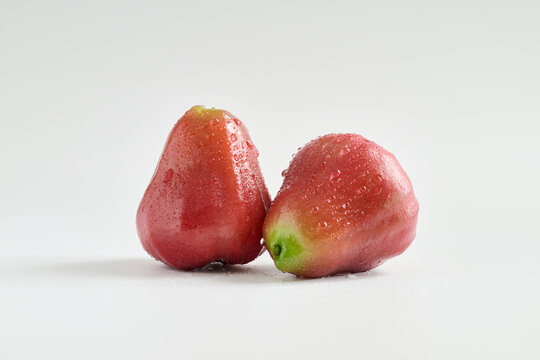 Commercial Photography of Fresh Red Wax Apples with Water Droplets on White Background